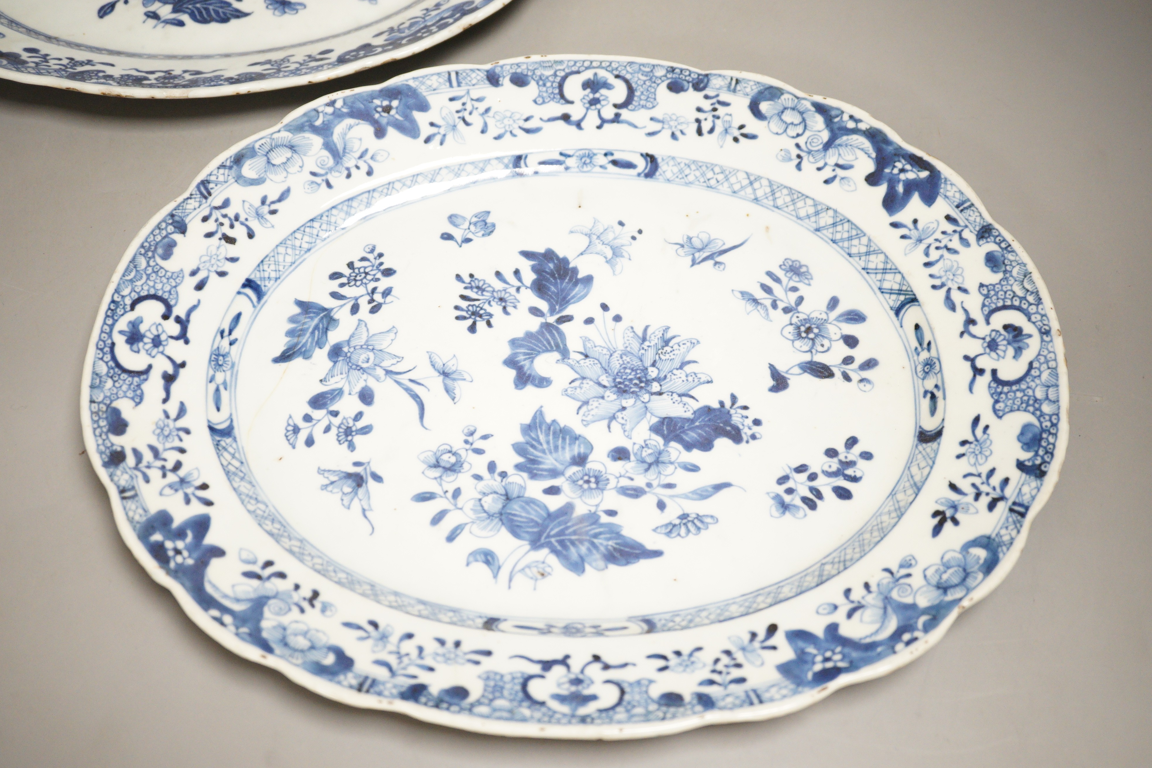 A pair of Chinese blue and white platters, decorated flowers, late 18th century, 34.5cm